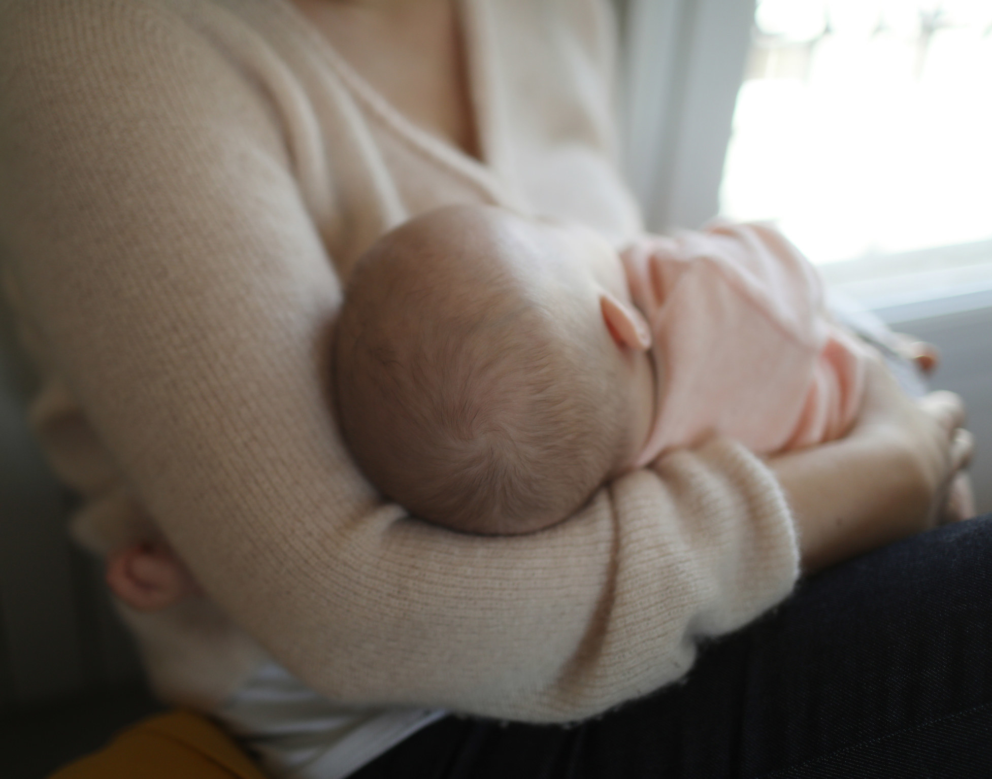 A woman breastfeeding her baby