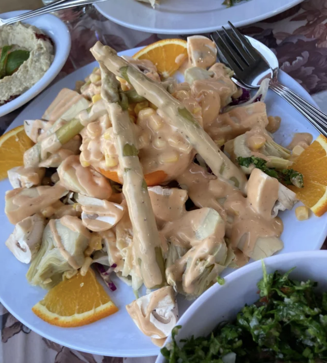 salad covered in orange dressing