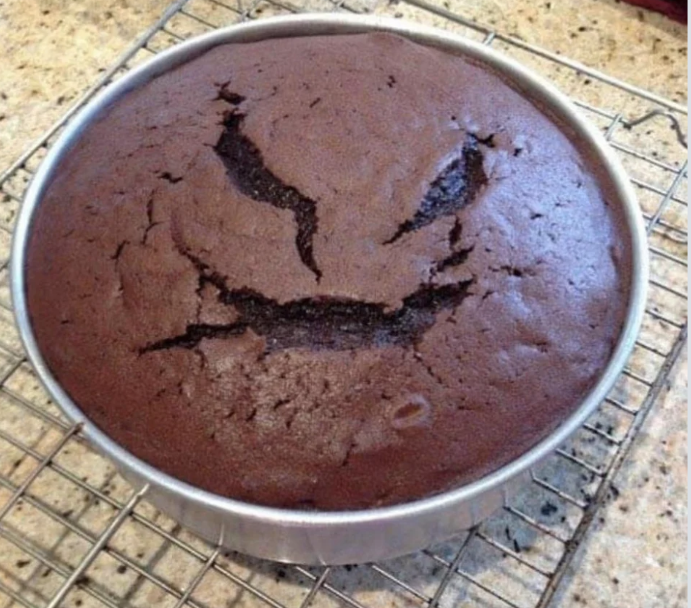 chocolate cake that&#x27;s got cracks in the shape of a scary face