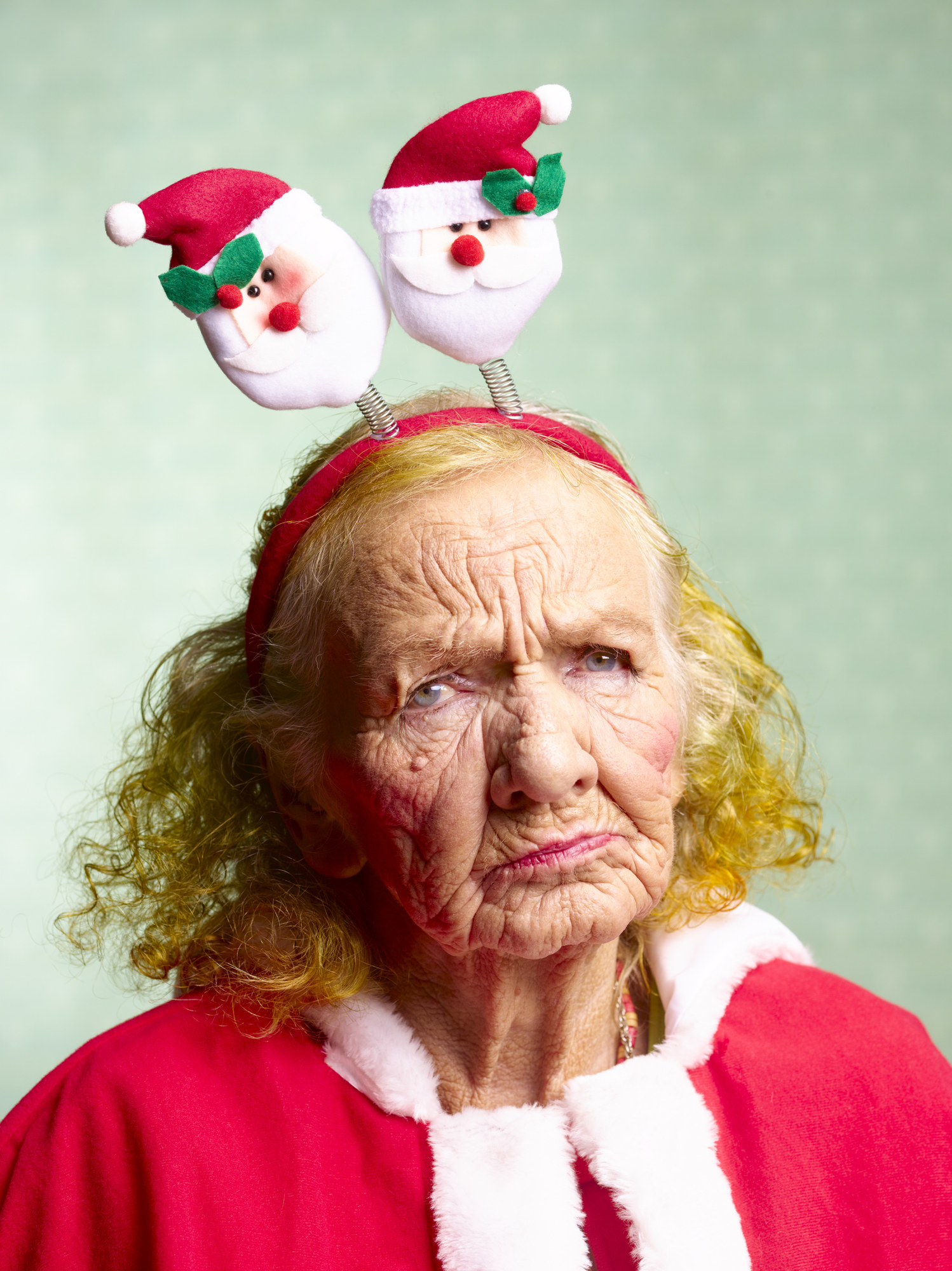 An older woman looking angry dressed up for Christmas