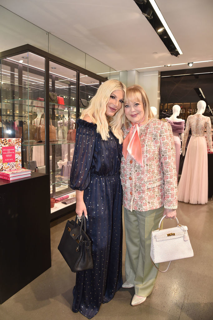 Tori and Candy Spelling in a shop