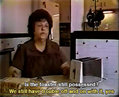 woman bemoans a possessed toaster