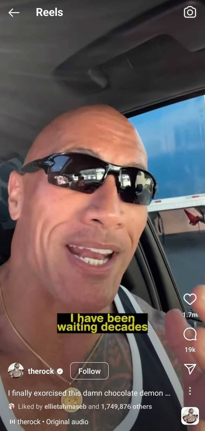 Dwayne Johnson speaking into his camera in his car