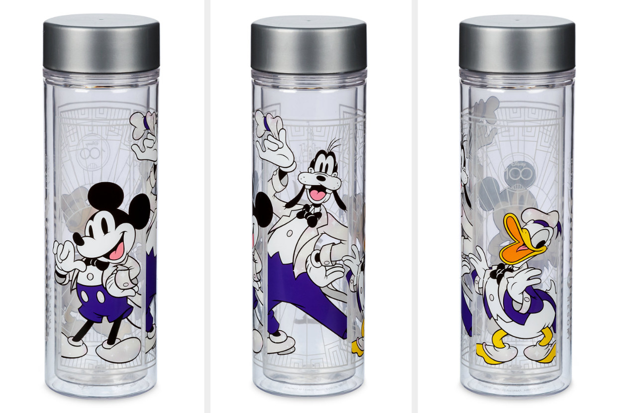 A clear water bottle with a screw top that has mickey, goofy, and donald in their celebratory tuxedos