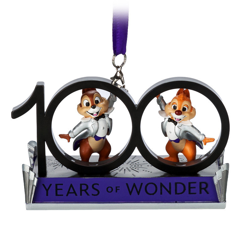 A christmas ornament that says 100 years of wonder with Chip and Dale standing in the zeros
