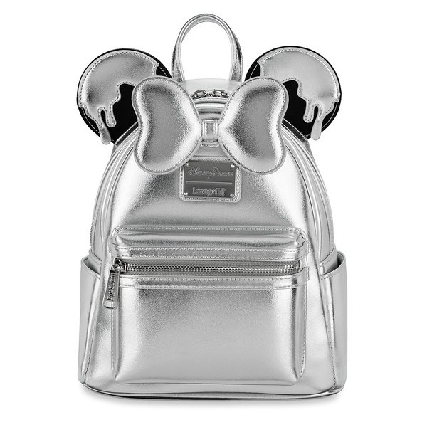 A mini backpack with 3d Minnie Moues ears that have a drip design on top and a 3D Minnie Mouse bow