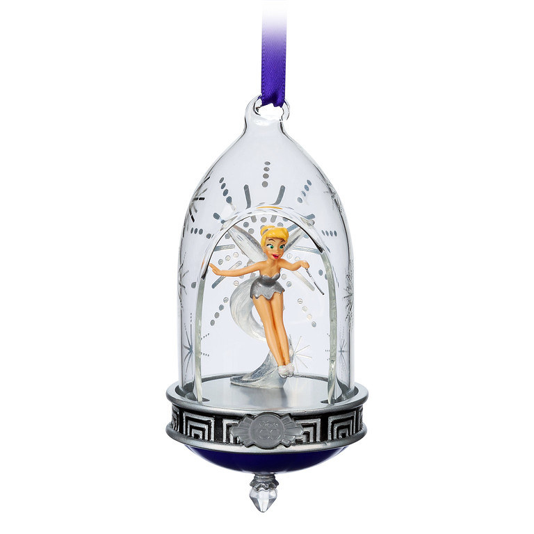 A christmas ornament with tinkerbell inside a glass jar