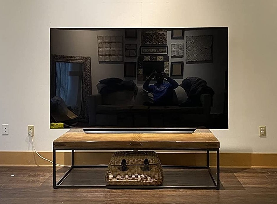 a reviewer photo of the 83 inch TV in their living room