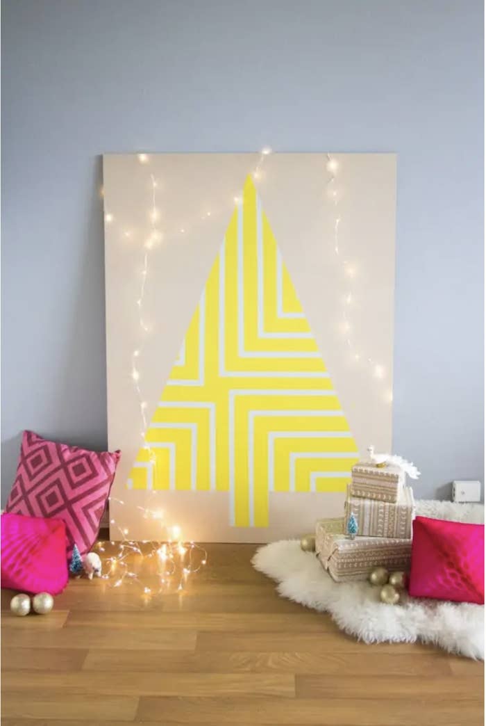painted plywood in the shape of a Christmas tree
