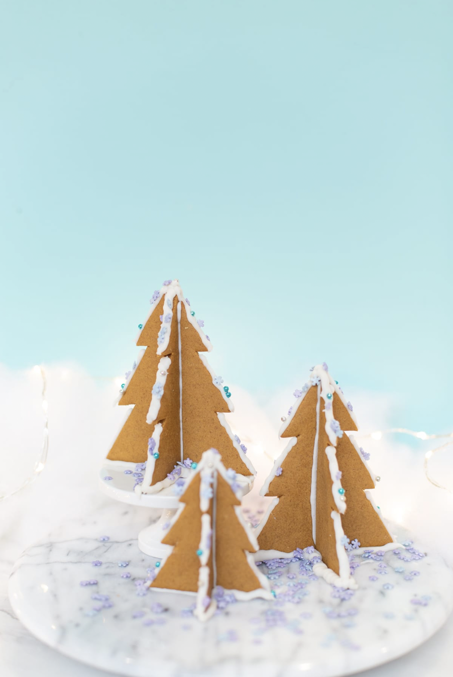 three gingerbread Christmas trees with sprinkles