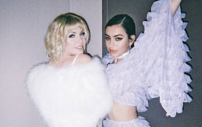 carly rae jepsen and charli xcx stand next to each other and smile