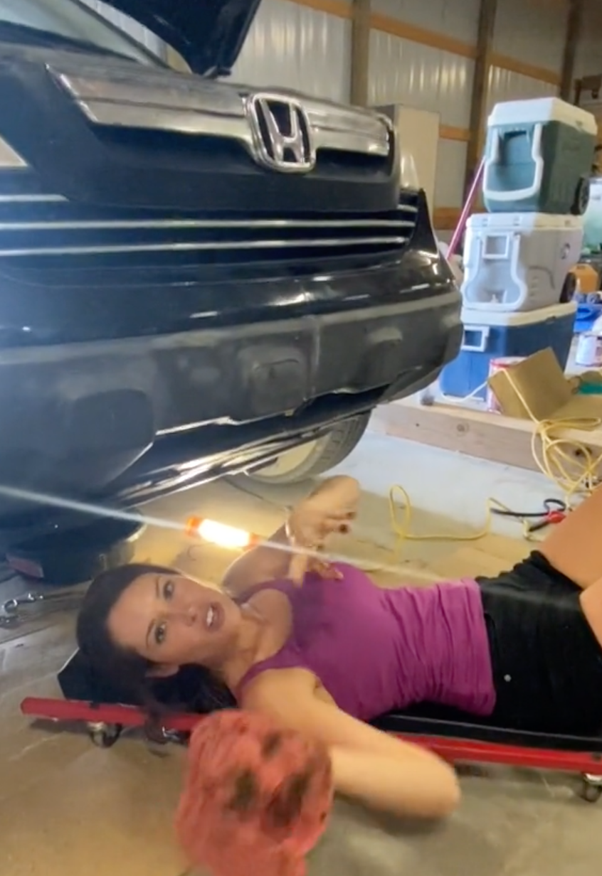 Krista changing her oil