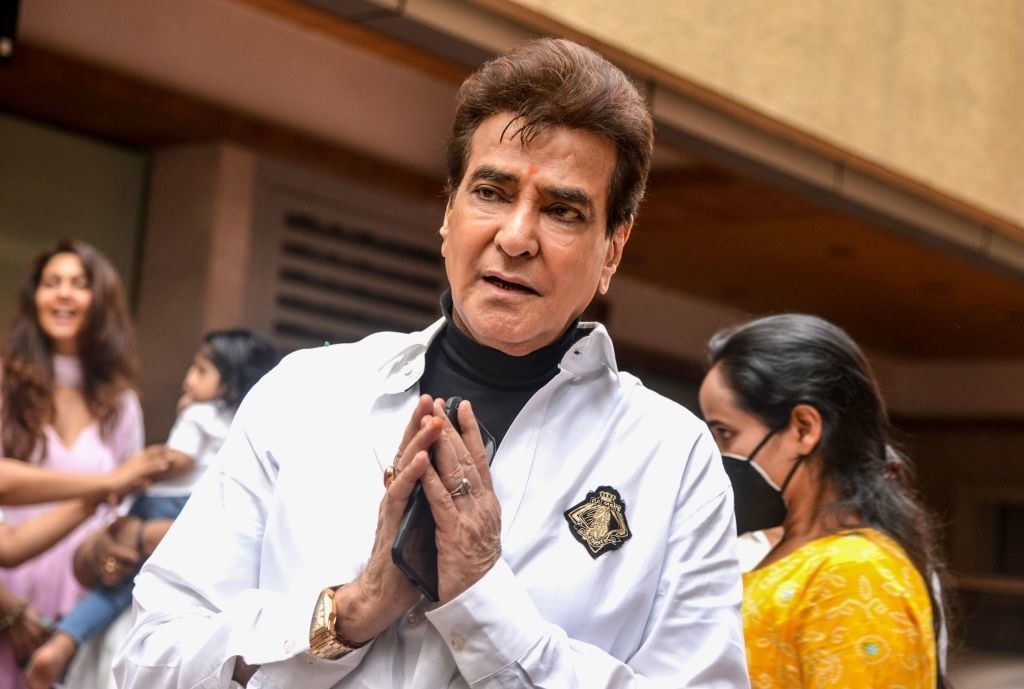 Bollywood veteran actor Jeetendra gestures as he poses for photographs