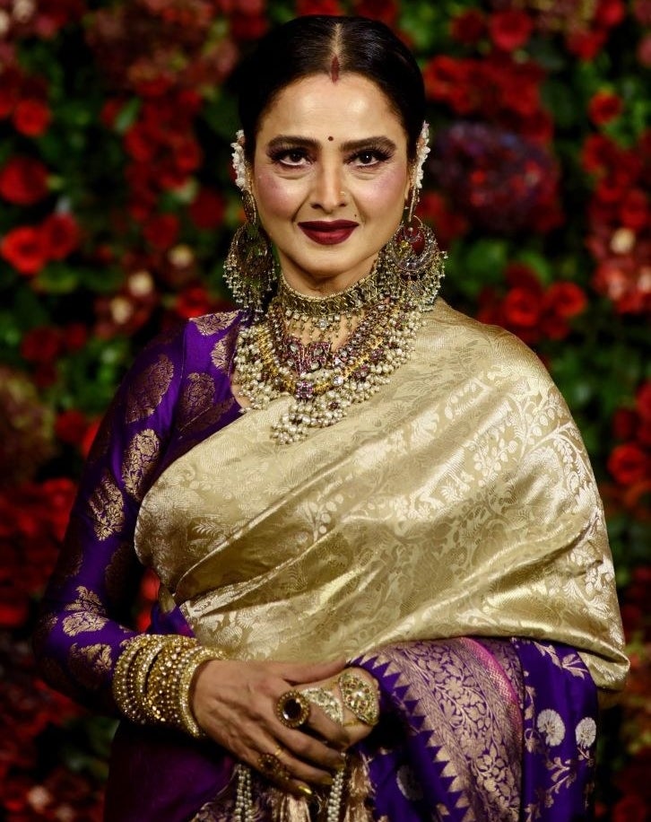 Indian Bollywood actress Rekha poses for a picture during the wedding reception party of actors Ranveer Singh and Deepika Padukone in Mumbai