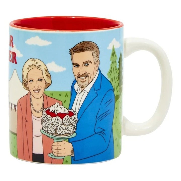 A mug with Mary Berry and Paul Hollywood from The Great British Baking Show holding a cake
