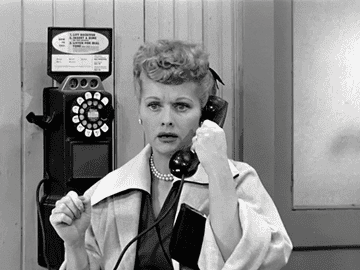 lucille ball talking on a rotary phone