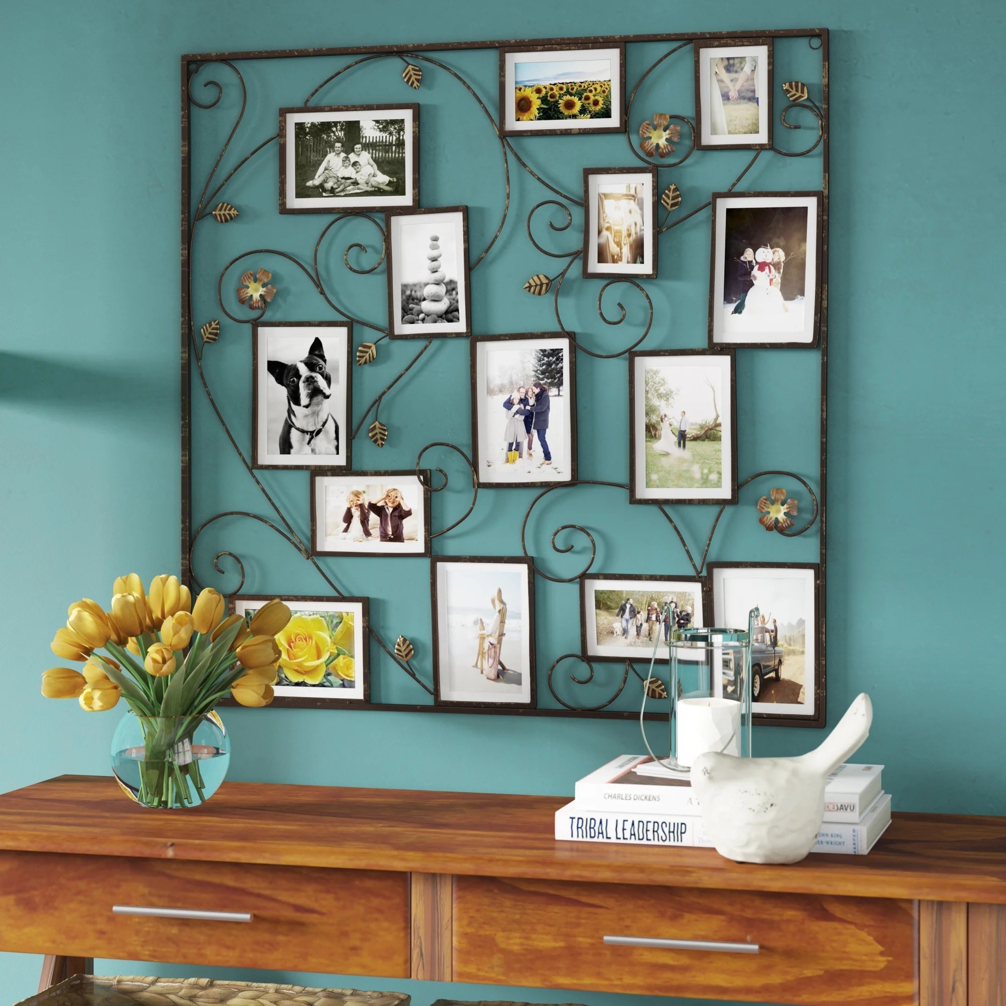 the collage frame with photos in it above a console table