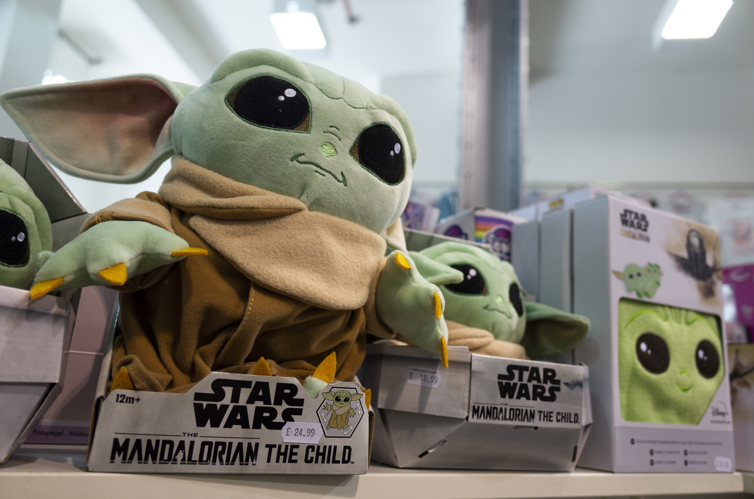 Baby Yoda, a popular character from the Mandalorian branch of the Star Wars franchise, merchandise on sale as fans across the world celebrate Star Wars Day on 30th April, 2022 in Leeds, United Kingdom.