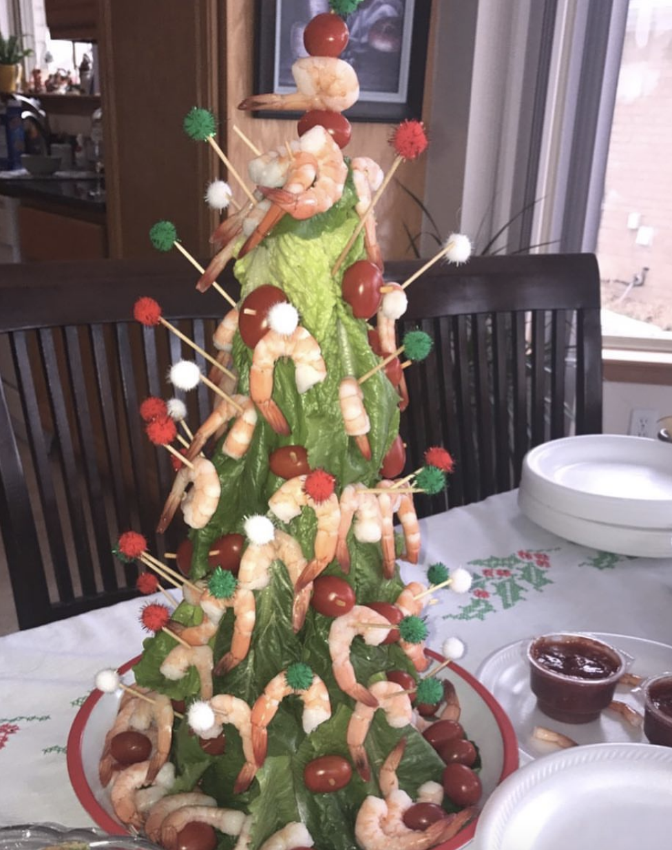 A small Christmas food tree covered in shrimp