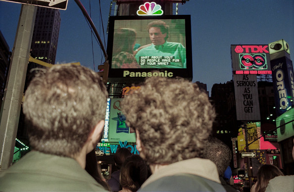 Crowds watching the final episode of the TV series &quot;Seinfeld&quot; broadcast in Times Square in New York City on the Jumbotron screen