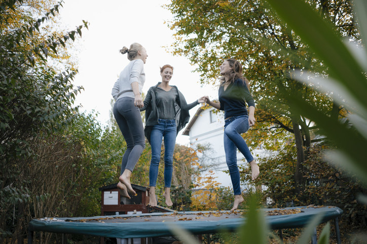 people jumping on a trampoline