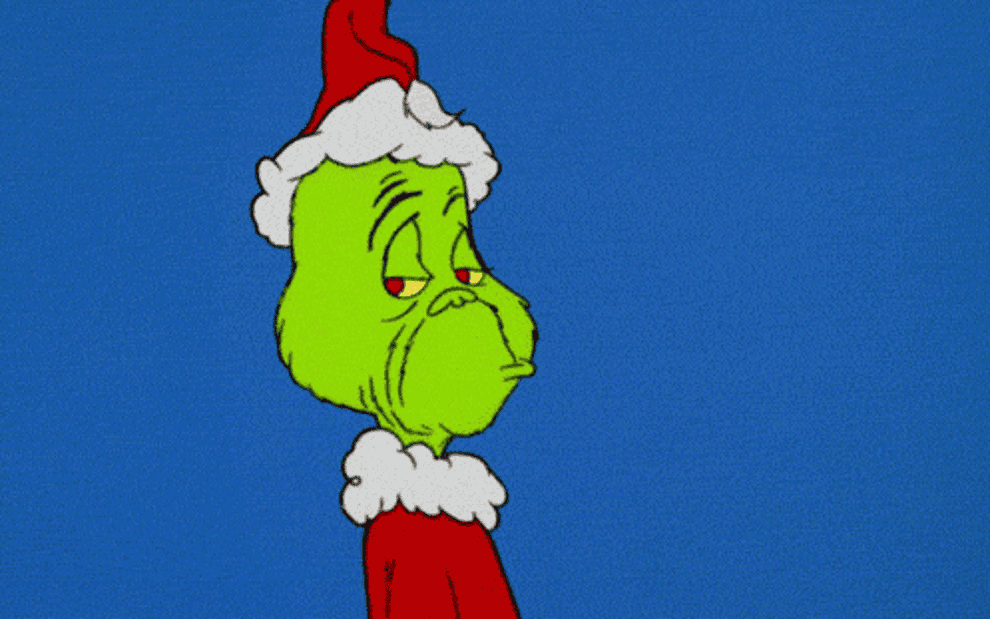 the cartoon grinch dressed as santa frowning and walking away