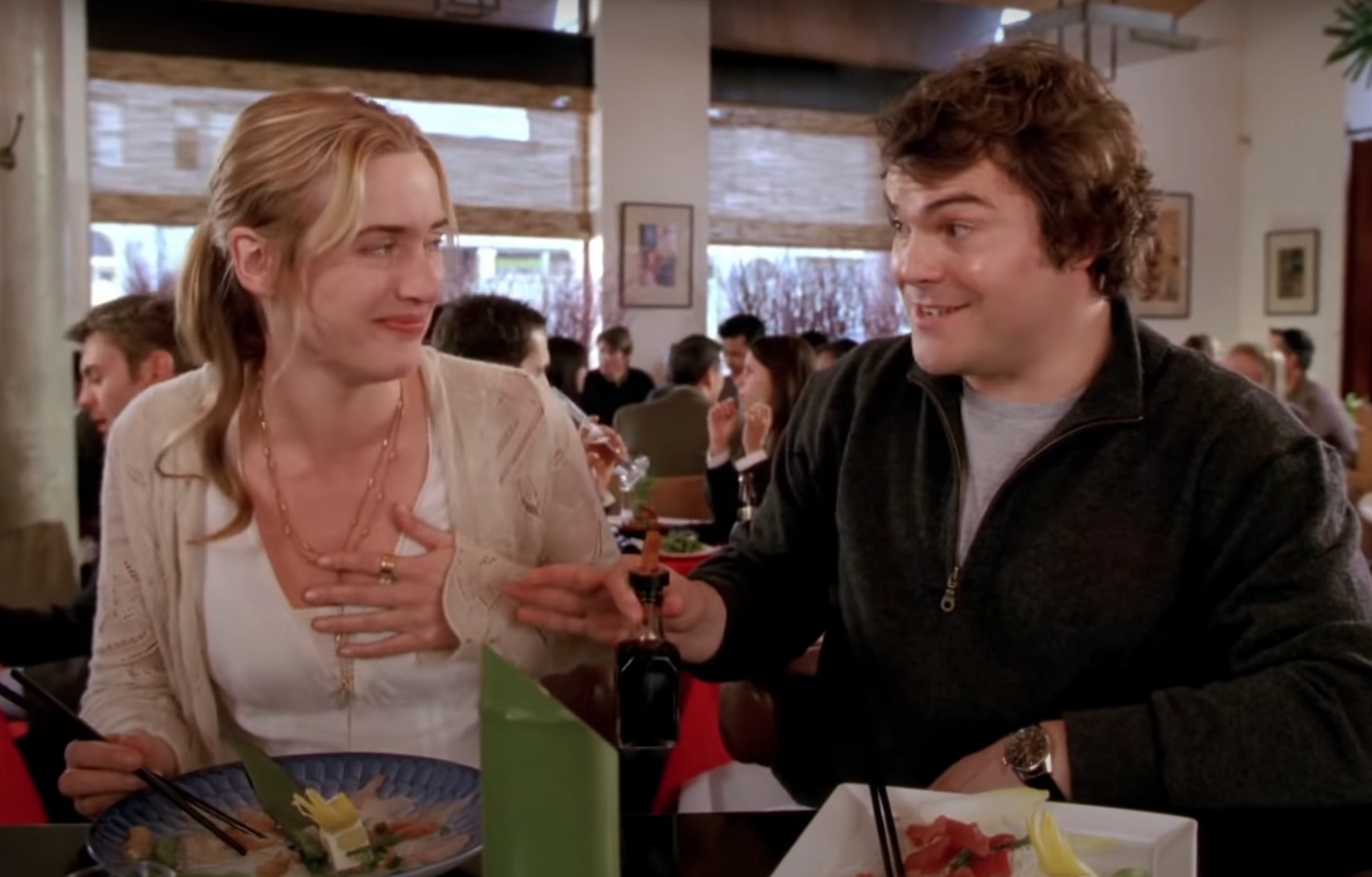 Kate Winslet as Iris and Jack Black as Miles chat during a meal