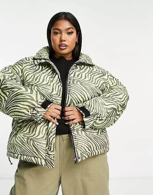 model in light and dark green wavy tiger print short puffer jacket