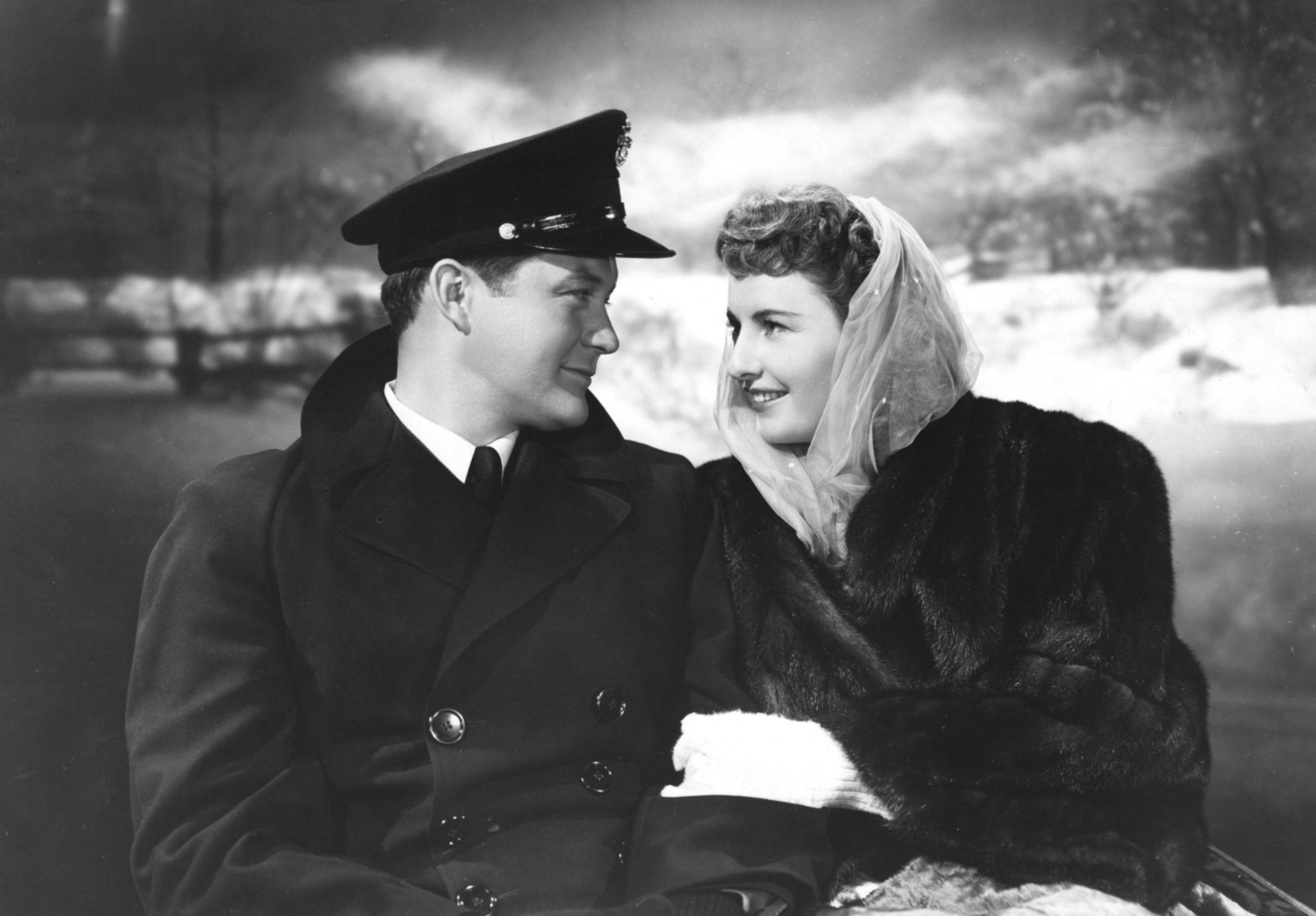 Dennis Morgan and Barbara Stanwyck staring lovingly at each other.