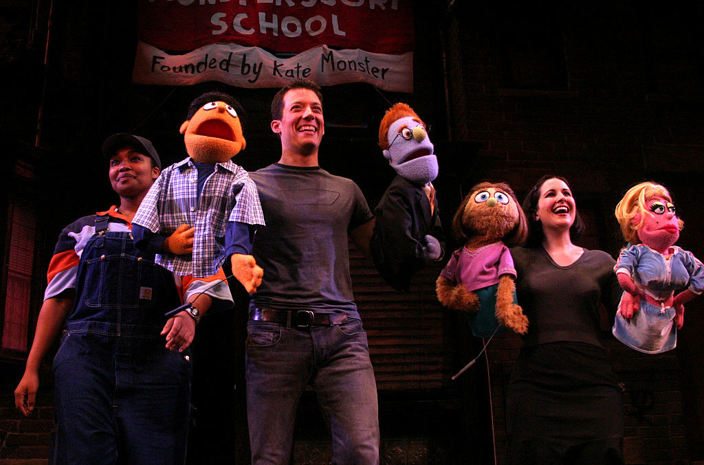 the cast of Avenue Q onstage