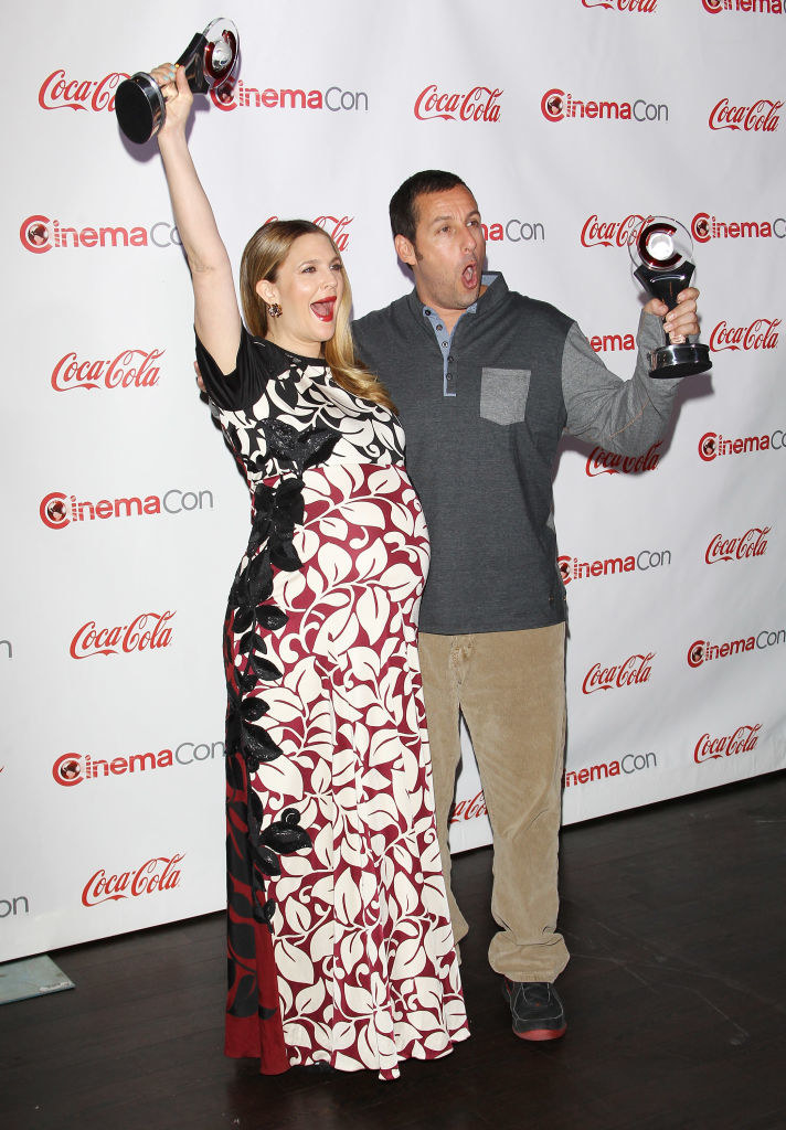 Drew and Adam holding up their awards