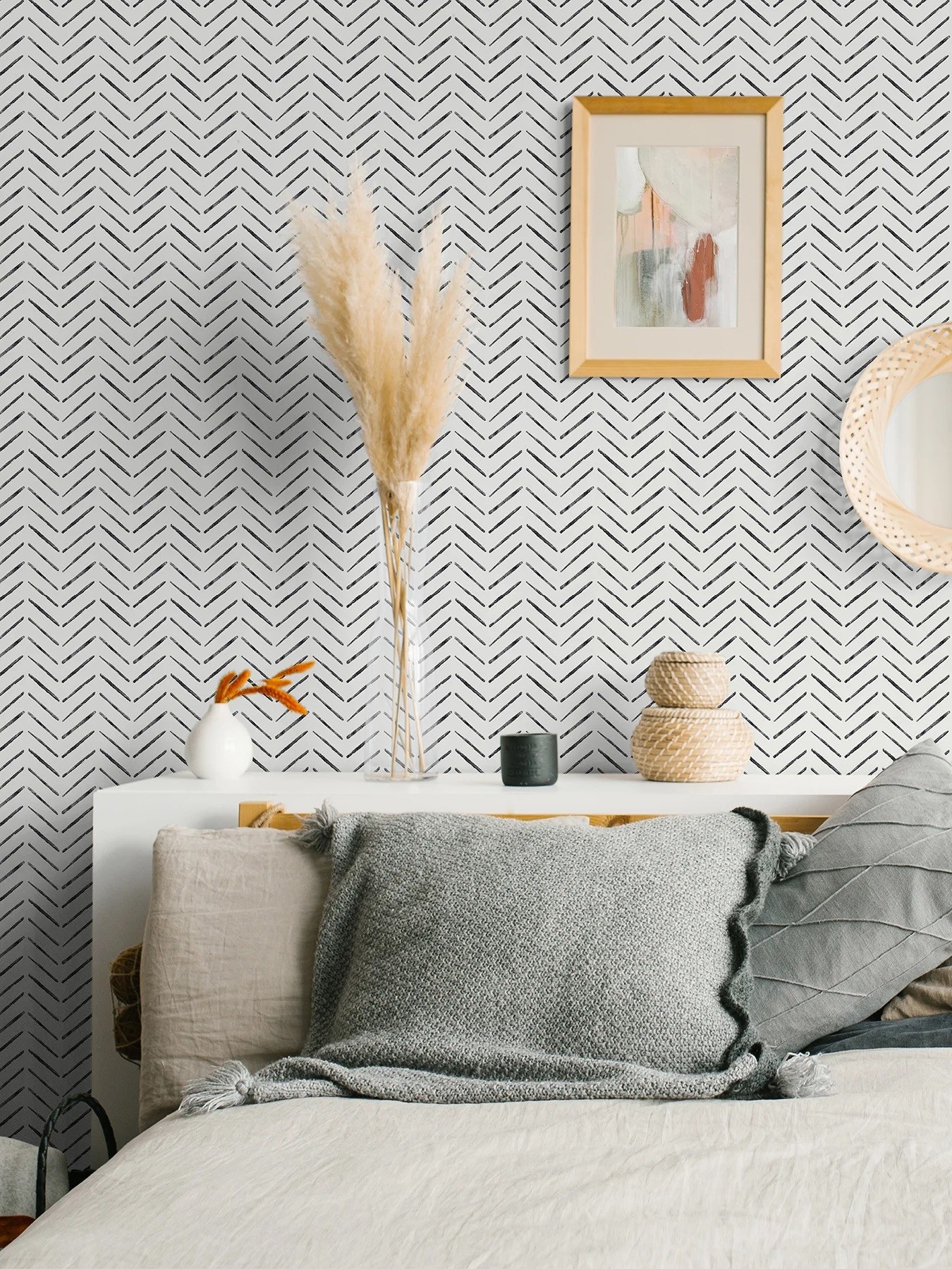 the black and white chevron wallpaper above a bed