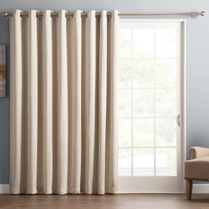 Pearl color curtains hanging in front of doorway