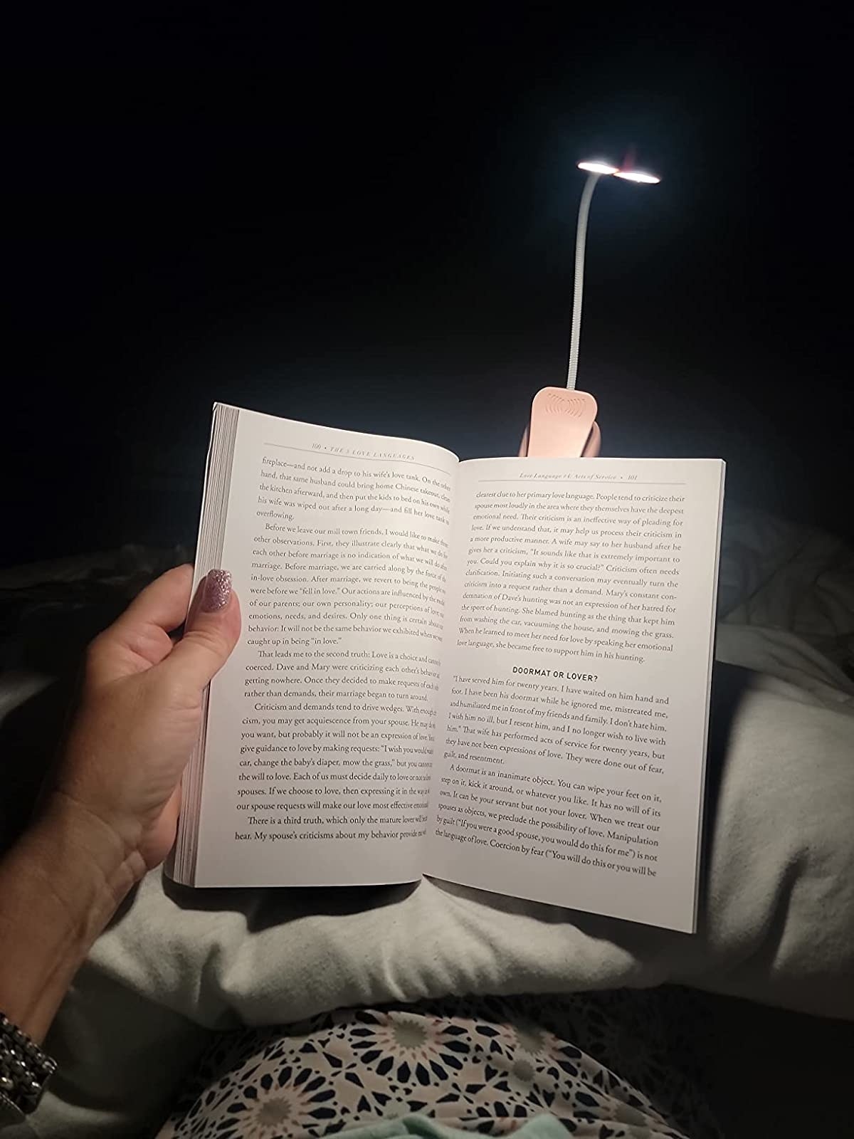 Reviewer using light to read in bed