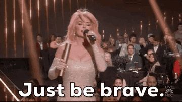 gif of shania twain saying just be brave while accepting an award