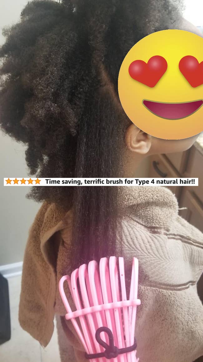 A reviewer using the brush to comb their child's hair with 5 star review text 