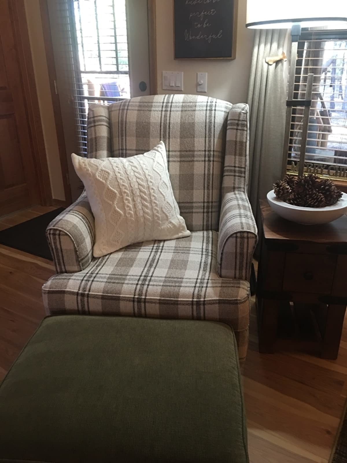 Reviewer image of white pillow on a plaid armchair