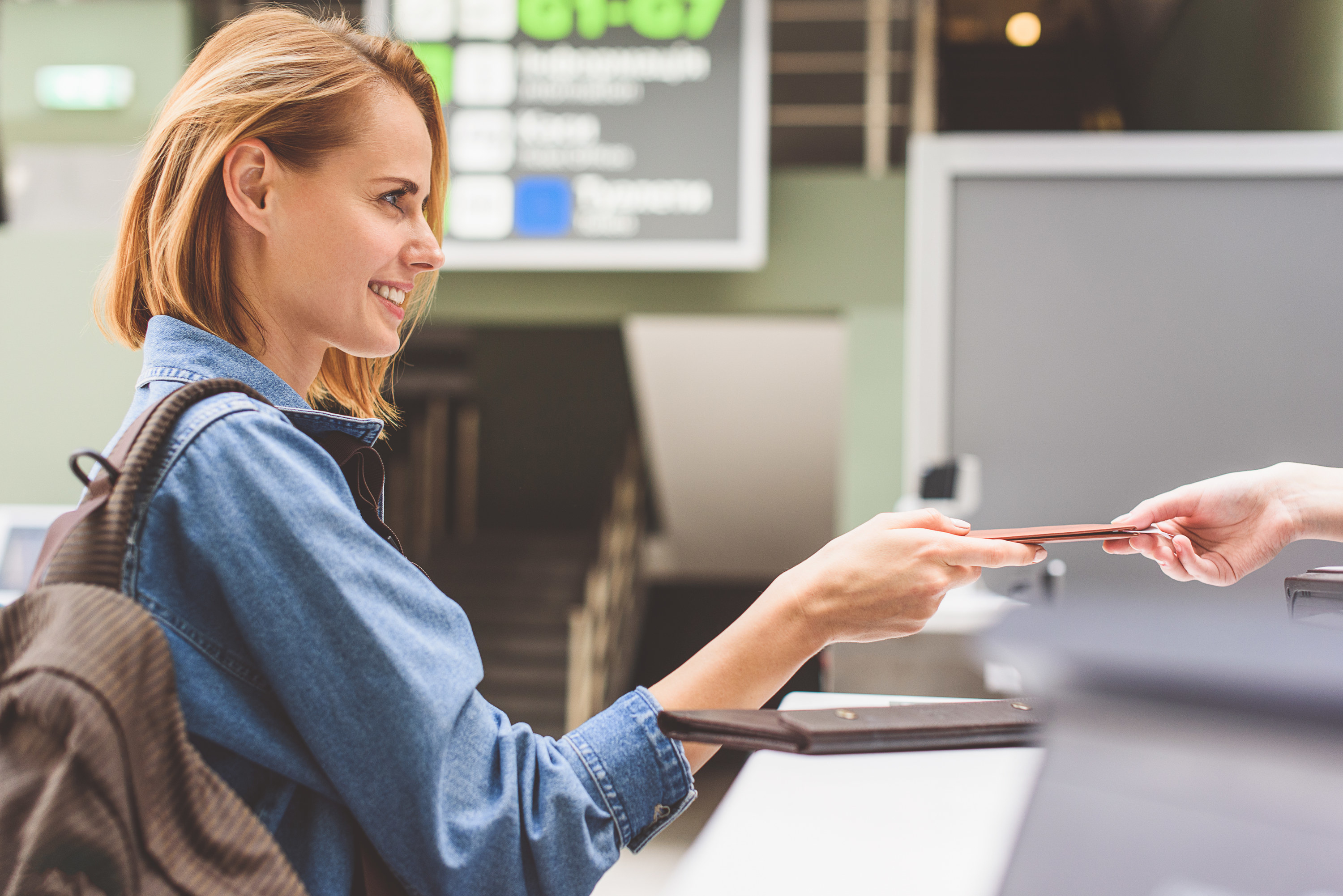 a woman at the airport giving their ID