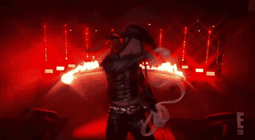 gif of cowgirl in front of fire