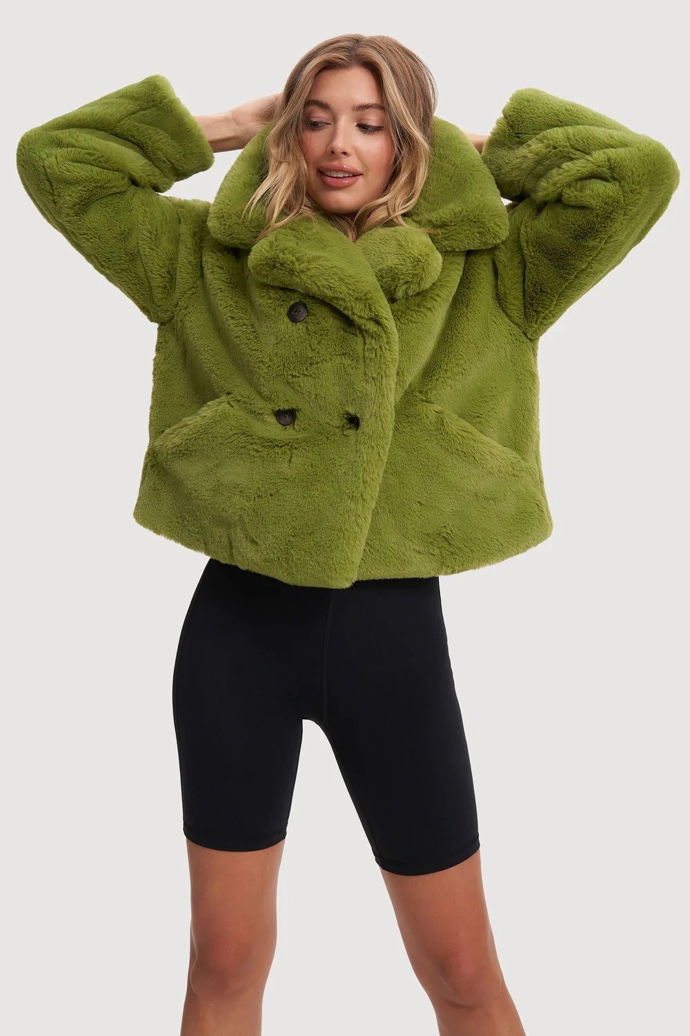 model in the palm green collared hip-length jacket