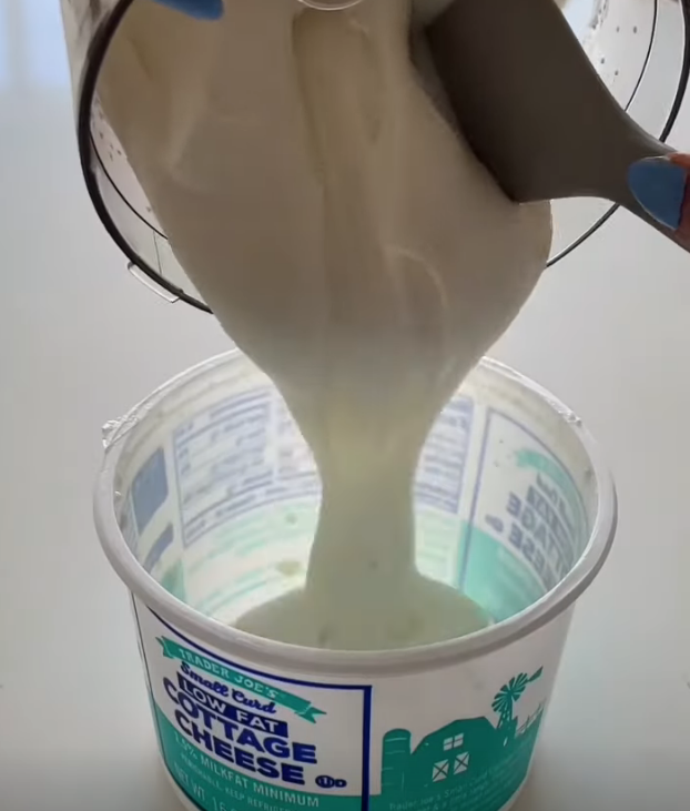 pouring whipped cottage cheese into the original cottage cheese container