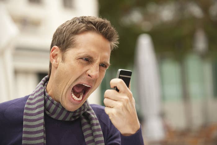 Man screaming at a cellphone