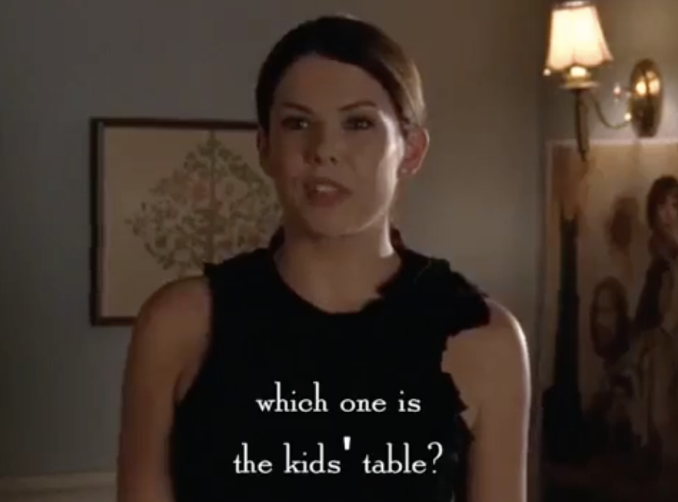 a woman asking, &quot;which one is the kid&#x27;s table?&quot;
