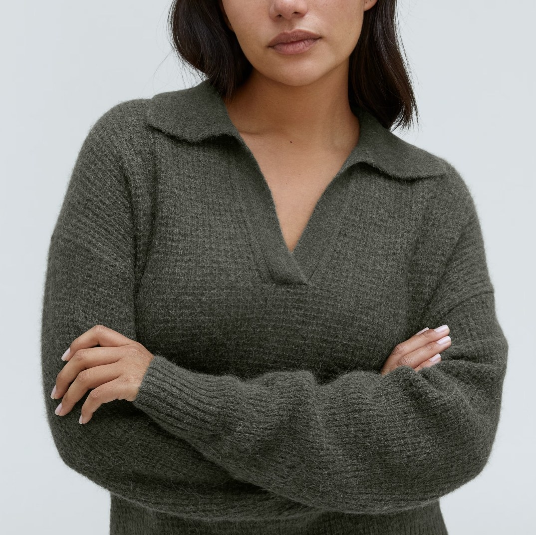 Model wearing grey sweater