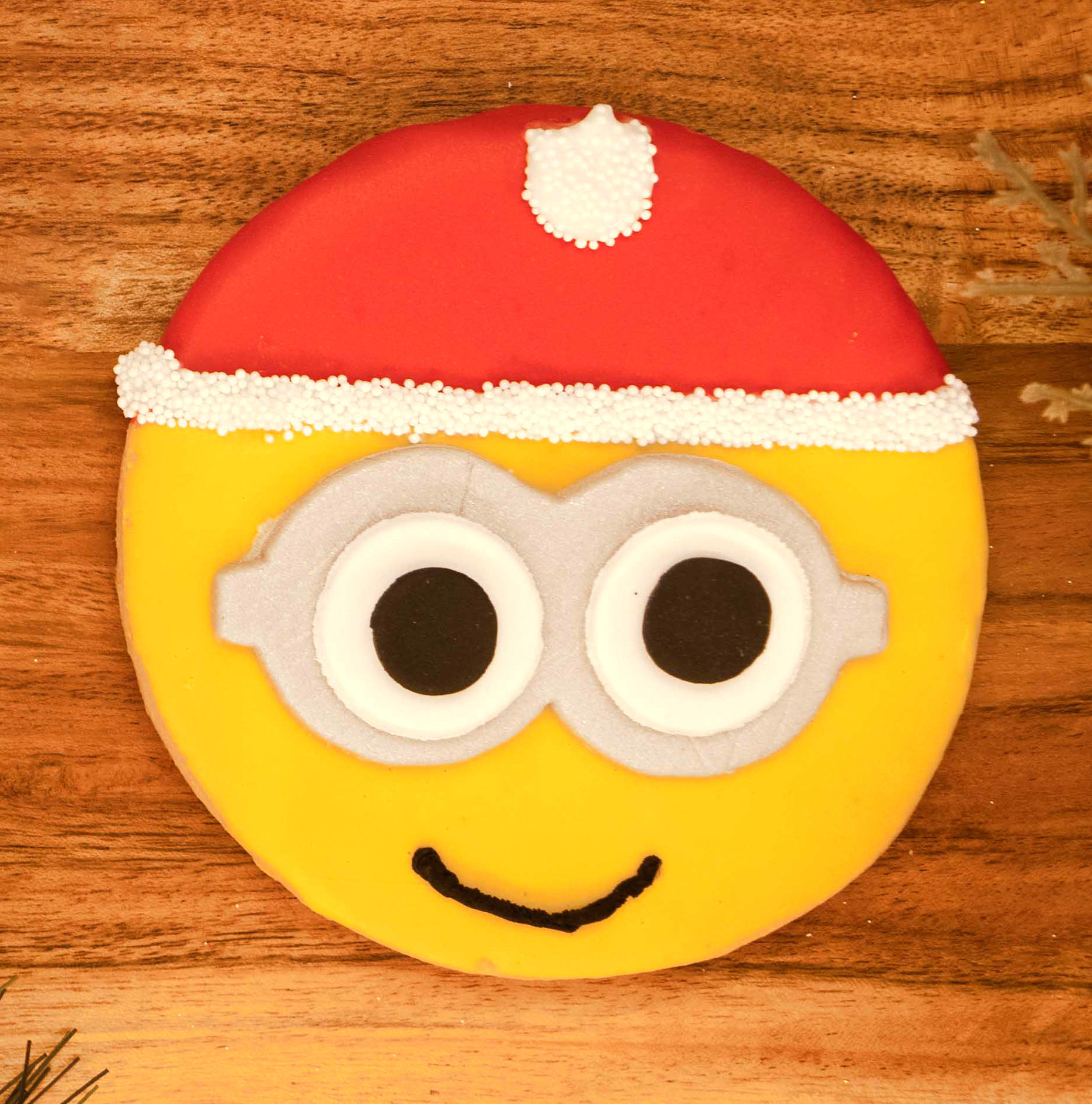 Minion wearing a Santa hat cookie