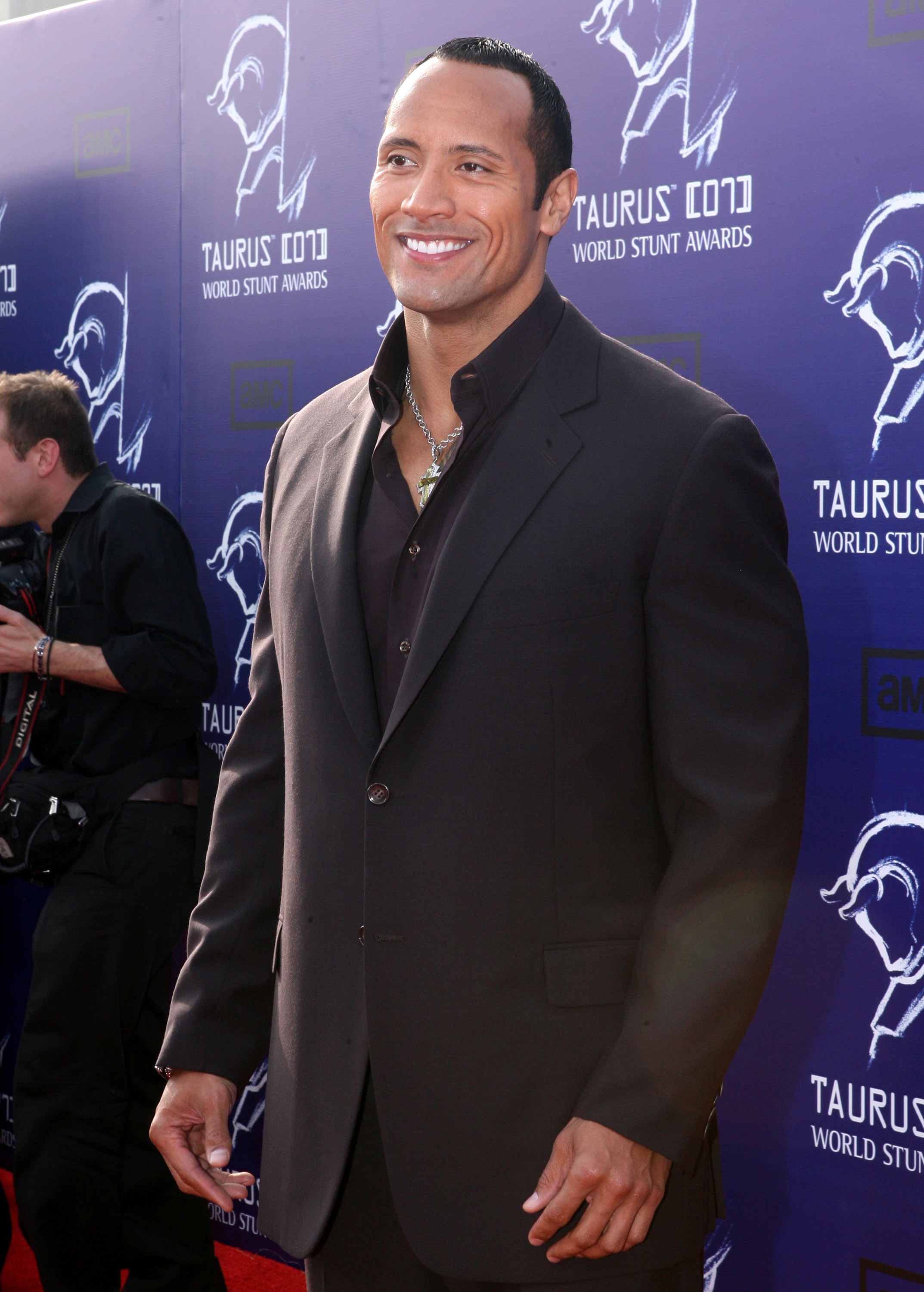 Dwayne on the red carpet in a suit, no tie