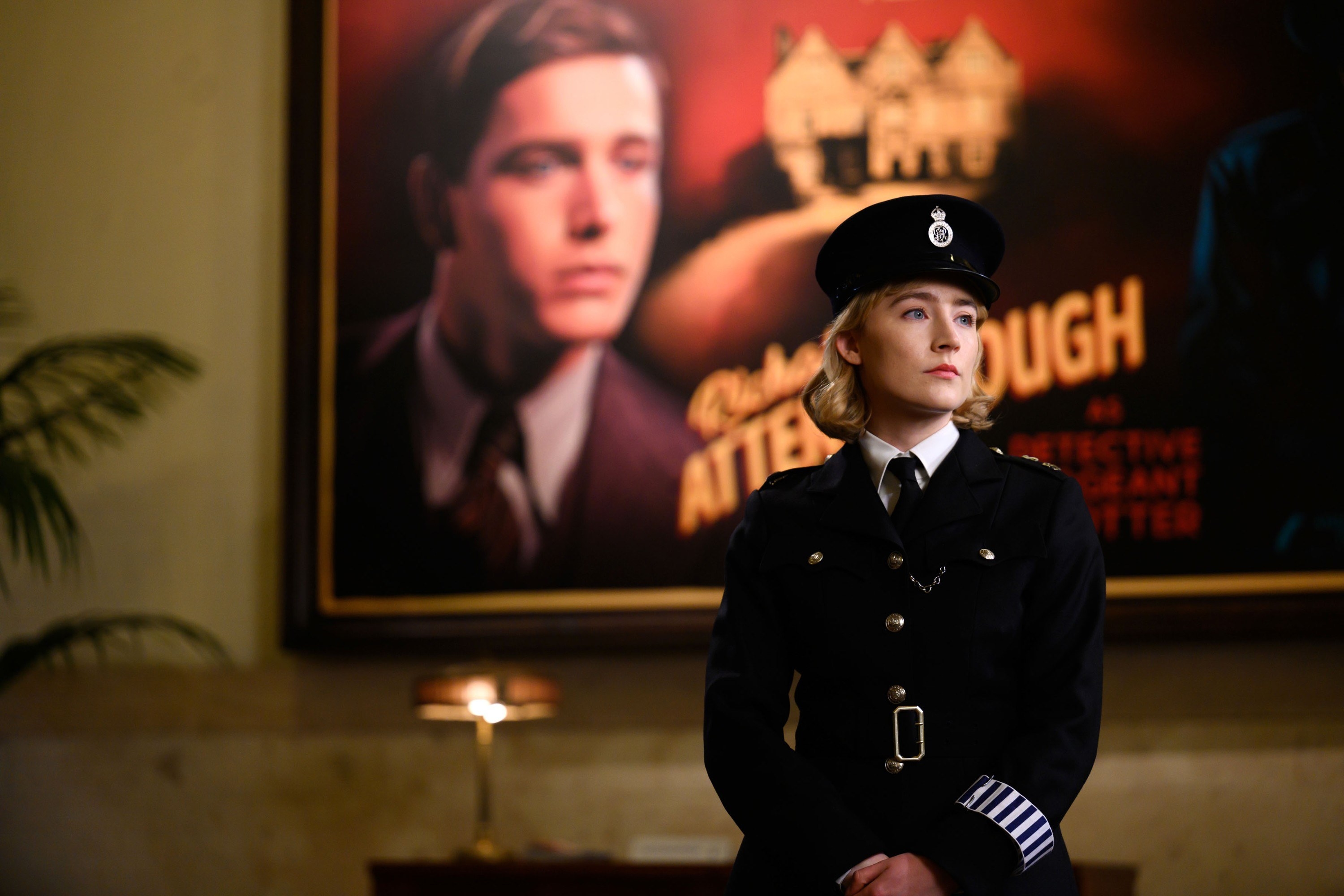 Saoirse Ronan wears a security uniform