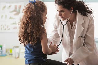 An image of a child visiting her doctor.