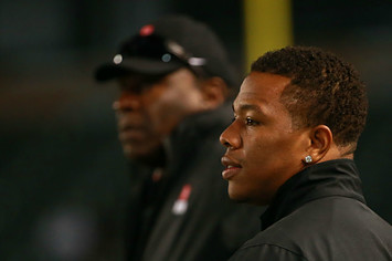 Running back coach Ray Rice of the from the sideline