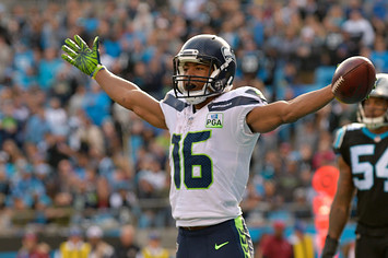 Tyler Lockett #16 of the Seattle Seahawks celebrates a touchdown against the Carolina Panthers